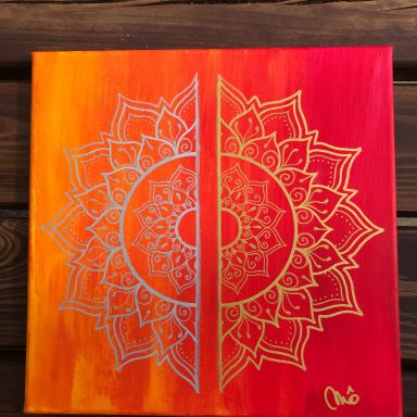 Mandala coloré en dégradé d'orange et rouge avec des motifs détaillés.